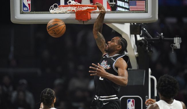 Los Angeles Clippers&#x27; Kawhi Leonard (2) makes a dunk during first half of an NBA basketball game against the Toronto Raptors Wednesday, March 8, 2023, in Los Angeles. (AP Photo/Jae C. Hong)