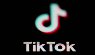 The icon for the video-sharing TikTok app is seen on a smartphone, on Feb. 28, 2023. (AP Photo/Matt Slocum)