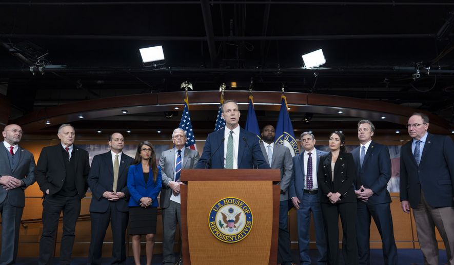 Rep. Scott Perry, R-Pa., center, and members of the House Freedom Caucus speak against Democratic policies and President Joe Biden&#x27;s agenda with a focus on the debt limit, at the Capitol in Washington, Friday, March 10, 2023. (AP Photo/J. Scott Applewhite) ** FILE **