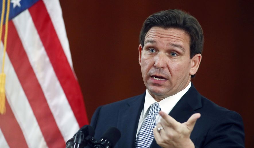 Florida Gov. Ron DeSantis answers questions from reporters after his State of the State address during a joint session of the Senate and House of Representatives on March 7, 2023, at the Capitol in Tallahassee, Fla. DeSantis will be in Iowa on March 10 to introduce himself to an expectant audience of Republicans, making a long-awaited visit ahead of a likely 2024 presidential bid. (AP Photo/Phil Sears)