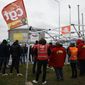 Oil workers gather at the Donges oil refinery, western France, Friday, March 10, 2023 in Paris. French President Emmanuel Macron insisted on the need for raising the legal retirement age from 62 to 64 with the aim to make the French pension system financially sustainable in the coming years. The move comes after more than a million demonstrators marched in cities and towns across France this week as train and metro drivers, refineries workers and others have started open-ended strikes against the centrist government&#x27;s plan. (AP Photo/Jeremias Gonzalez)