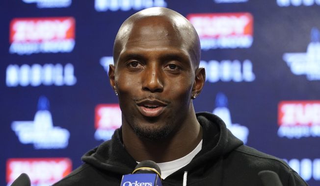New England Patriots safety Devin McCourty faces reporters following an NFL football practice, Wednesday, Dec. 21, 2022, in Foxborough, Mass. McCourty is retiring from the NFL, ending a 13-year run with the team that included winning three Super Bowl rings. (AP Photo/Steven Senne, File)