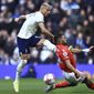 Tottenham&#x27;s Richarlison, left, duels for the ball with Nottingham Forest&#x27;s Renan Lodi during the English Premier League soccer match between Tottenham Hotspur and Nottingham Forest, at the Tottenham Hotspur stadium in London, Saturday, March 11, 2023. (AP Photo/Leila Coker)