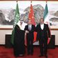 In this photo released by Xinhua News Agency, Ali Shamkhani, the secretary of Iran&#x27;s Supreme National Security Council, at right, shakes hands with Saudi National Security Adviser Musaad bin Mohammed al-Aiban, at left, as Wang Yi, China&#x27;s most senior diplomat, looks on, at center, for a photo during a closed meeting held in Beijing, Saturday, March 11, 2023. Iran and Saudi Arabia agreed Friday to reestablish diplomatic relations and reopen embassies after seven years of tensions. The major diplomatic breakthrough negotiated with China lowers the chance of armed conflict between the Mideast rivals, both directly and in proxy conflicts around the region. (Luo Xiaoguang/Xinhua via AP)