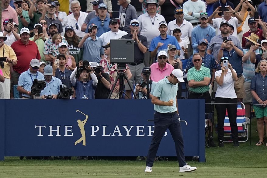 Scottie Scheffler reacts after hitting from the 17th tee during the final round of The Players Championship golf tournament, Sunday, March 12, 2023, in Ponte Vedra Beach, Fla. (AP Photo/Eric Gay)