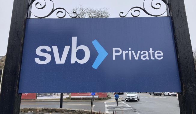 A Silicon Valley Bank sign is shown outside branch in Wellesley, Mass on Saturday, March 11, 2023. Regulators have seized the assets of one of Silicon Valley’s top banks, marking the largest failure of a U.S. financial institution since the height of the financial crisis almost 15 years ago. (AP Photo/Peter Morgan)