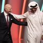 FIFA President Gianni Infantino, left, and Emir of Qatar Sheikh Tamim bin Hamad Al Thani leave the stage before the 2022 soccer World Cup draw at the Doha Exhibition and Convention Center in Doha, Qatar, on April 1, 2022. A spying operation on behalf of World Cup host Qatar bugged a 2017 hotel meeting between Infantino and Switzerland’s then-attorney general during an investigation of soccer officials, Swiss daily Neue Zürcher Zeitung reported Sunday March 12, 2023. (AP Photo/Hassan Ammar, File)