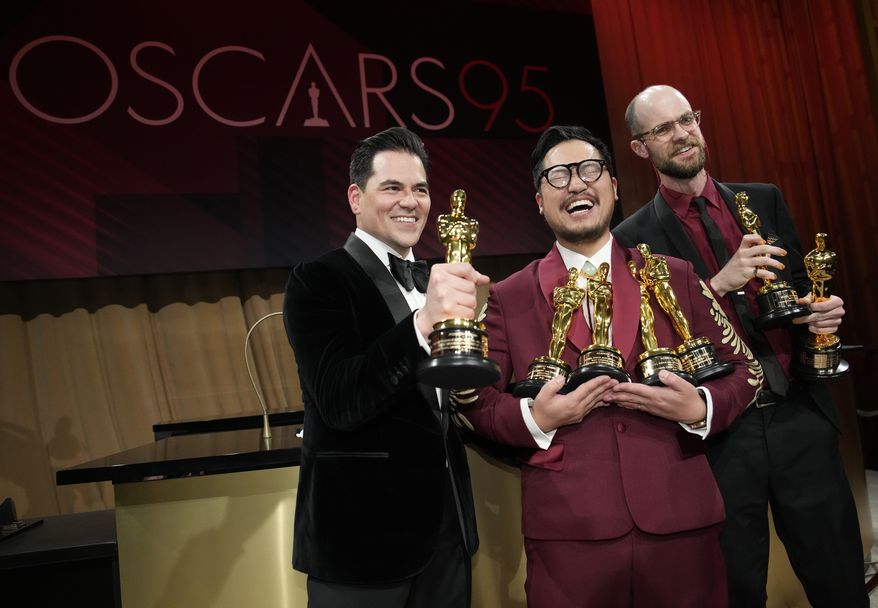 Jonathan Wang, from left, Daniel Kwan and Daniel Scheinert pose with their awards for best picture for &quot;Everything Everywhere All at Once&quot; at the Governors Ball after the Oscars on Sunday, March 12, 2023, at the Dolby Theatre in Los Angeles. Daniel Kwan and Daniel Scheinerton also won the awards for best original screenplay and best director for &quot;Everything Everywhere All at Once.&quot; (AP Photo/John Locher)
