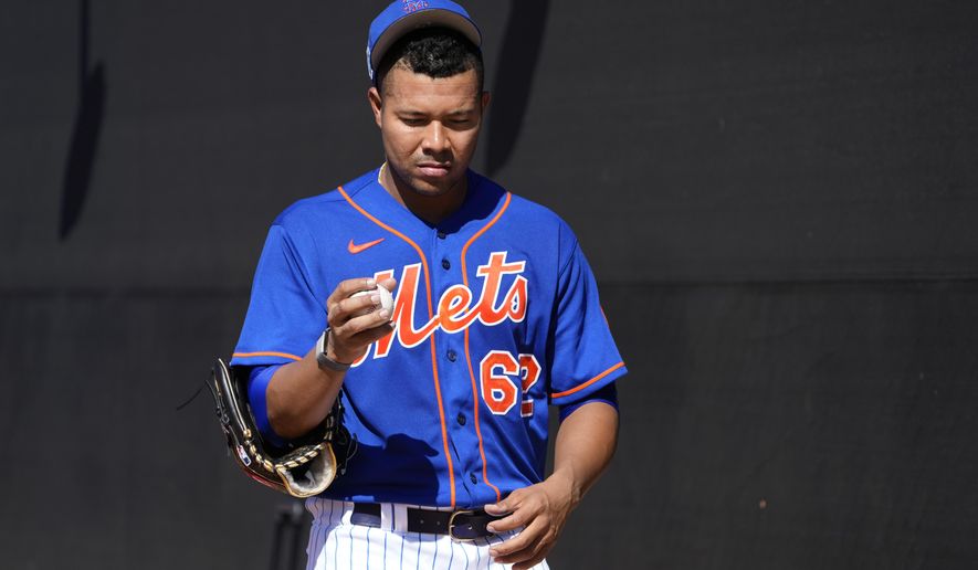 New York Mets pitcher Jose Quintana pauses during spring training baseball practice Monday, Feb. 20, 2023, in Port St. Lucie, Fla. (AP Photo/Jeff Roberson)