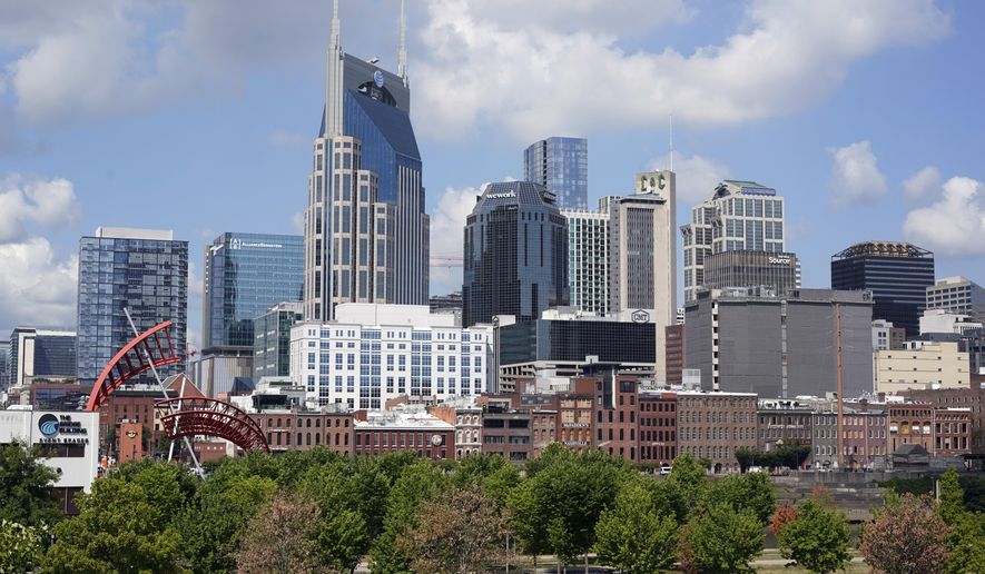 FILE - The Nashville, Tenn., skyline is shown July 11, 2022. Nashville officials on Monday, March 13, 2023, sued over a new Tennessee law that will cut the Democratic-leaning city's metro council in half, a move that follows the council’s rejection of efforts to host the 2024 Republican National Convention in Music City. (AP Photo/Mark Humphrey, File)