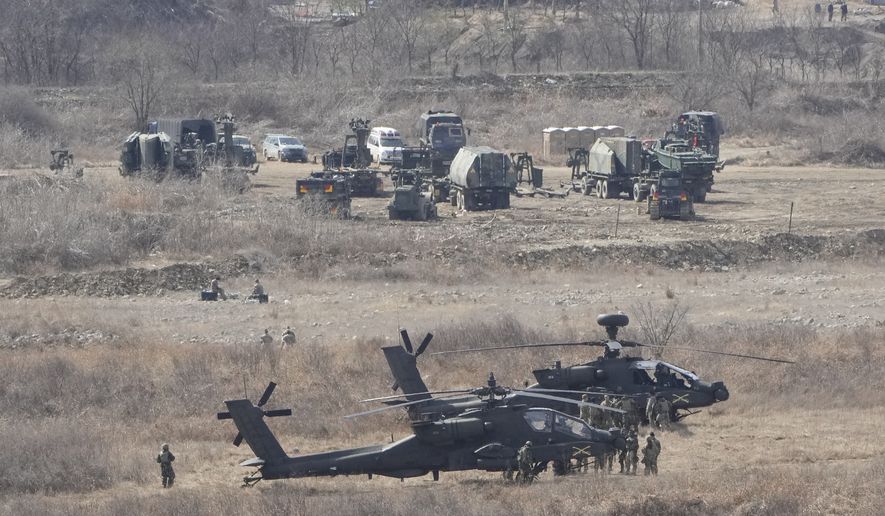 U.S. Army&#x27;s Apache helicopters park at a training field in Yeoncheon, near the border with North Korea, Monday, March 13, 2023. The South Korean and U.S. militaries launched their biggest joint military exercises in years on Monday, as North Korea said it tested submarine-launched cruise missiles in an apparent protest of the drills it views as an invasion rehearsal. (AP Photo/Ahn Young-joon)