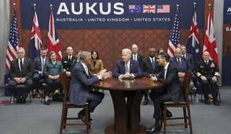 Britain&#x27;s Prime Minister Rishi Sunak, right, meets with US President Joe Biden and Prime Minister of Australia Anthony Albanese, left, at Point Loma naval base in San Diego, US, Monday March 13, 2023, as part of Aukus, a trilateral security pact between Australia, the UK, and the US. (Stefan Rousseau/Pool via AP)