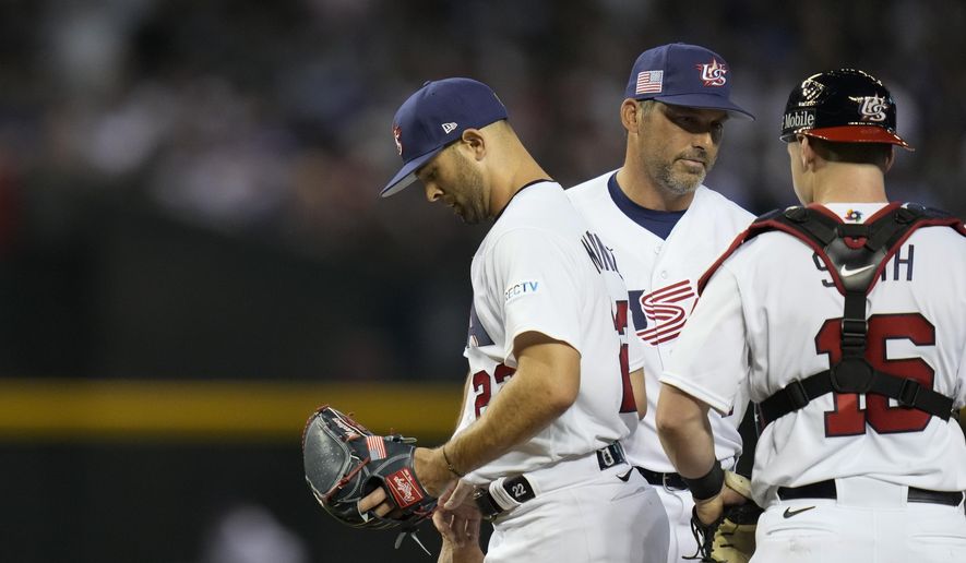 United States pitcher Nick Martinez, left, exits during the third inning of a World Baseball Classic game against Mexico in Phoenix, Sunday, March 12, 2023. (AP Photo/Godofredo A. Vásquez) **FILE**