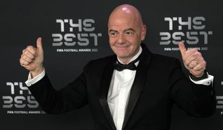 FIFA president Gianni Infantino poses on the green carpet before the ceremony of the Best FIFA Football Awards in Paris, France, Monday, Feb. 27, 2023. (AP Photo/Michel Euler)