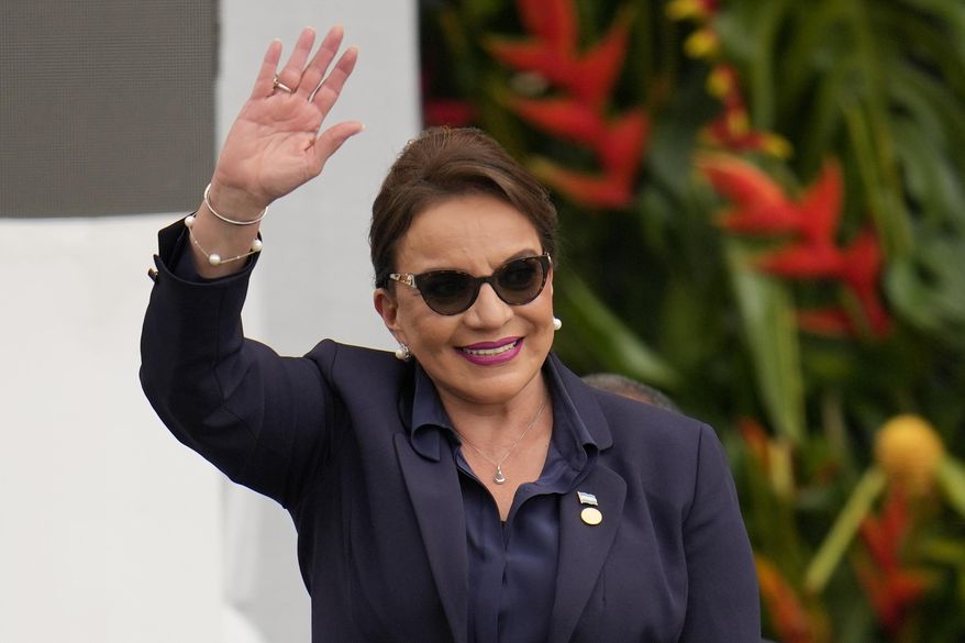 Honduras&#x27; President Xiomara Castro waves during the swearing-in ceremony for Colombia&#x27;s President Gustavo Petro in Bogota, Colombia, Sunday, Aug. 7, 2022. Castro announced on Tuesday, March 14, 2023, that Honduras under her administration is opening diplomatic relations with the People&#x27;s Republic of China. (AP Photo/Fernando Vergara, File)