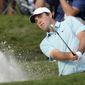 Scottie Scheffler hits from a bunker toward the 16th green during the final round of The Players Championship golf tournament, Sunday, March 12, 2023, in Ponte Vedra Beach, Fla. (AP Photo/Charlie Neibergall) **FILE**