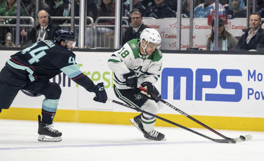 Dallas Stars forward Max Domi, right, skates against Seattle Kraken defenseman Jaycob Megna during the first period of an NHL hockey game, Monday, March 13, 2023, in Seattle. (AP Photo/Stephen Brashear)