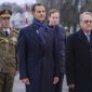In this photo released by the Syrian official news agency SANA, visiting Syrian President Bashar Assad, left, and Mikhail Bogdanov, right, Deputy Minister of Foreign Affairs of Russia and Special Representative of the President of Russia for the Middle East, review an honor guard during a welcome ceremony upon Assad&#x27;s arrival at Vnukovo airport in Moscow, Russia, Tuesday, March 14, 2023. Assad landed in Russia Tuesday where he is scheduled to meet top ally President Vladimir Putin. (SANA via AP)