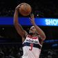 Washington Wizards guard Bradley Beal (3) shoots the ball during the first half of an NBA basketball game against the Detroit Pistons, Tuesday, March 14, 2023, in Washington. (AP Photo/Carolyn Kaster)