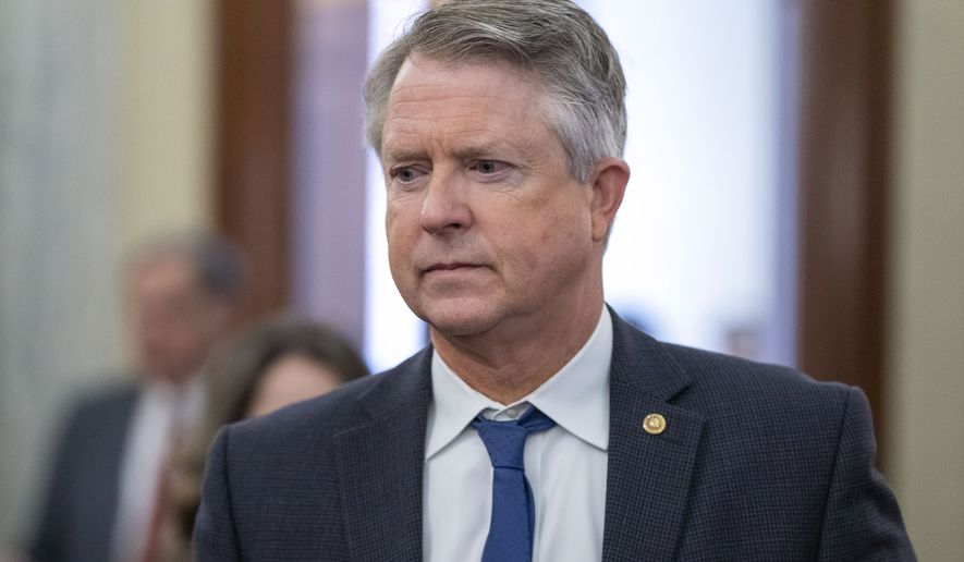 Sen. Roger Marshall, R-Kan., arrives for a hearing of the Senate Agriculture, Nutrition, and Forestry Committee to examine the Department of Agriculture, on Capitol Hill, Thursday, March 16, 2023 in Washington. (AP Photo/Alex Brandon)
