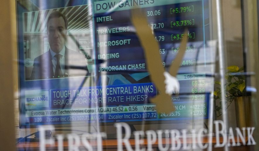 A television screen displaying financial news is seen inside one of First Republic Bank&#x27;s branches in the Financial District of Manhattan, Thursday, March 16, 2023. The S&amp;P 500 was 0.8% higher in midday trading after erasing an earlier loss of nearly that much following reports that First Republic Bank could receive financial assistance or sell itself to another bank. (AP Photo/Mary Altaffer)