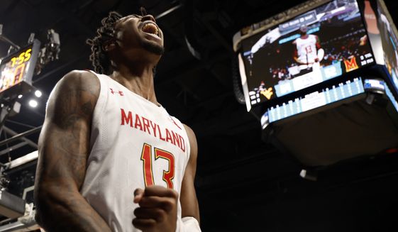 Maryland guard Hakim Hart (13) reacts after a basket in the second half of a first-round college basketball game against West Virginia in the NCAA Tournament in Birmingham, Ala., Thursday, March 16, 2023. Maryland won 67-65. (AP Photo/Butch Dill)