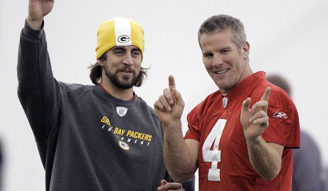FILE - Green Bay Packers quarterbacks Aaron Rodgers, left, and Brett Favre talk during NFL football practice in Green Bay, Wis., Jan. 16, 2008. The Packers have benefited from three decades of Hall of Fame-caliber quarterback production from Brett Favre and Aaron Rodgers. That&#x27;s quite the standard for 2020 first-round draft pick Jordan Love to meet. (AP Photo/Morry Gash, File)