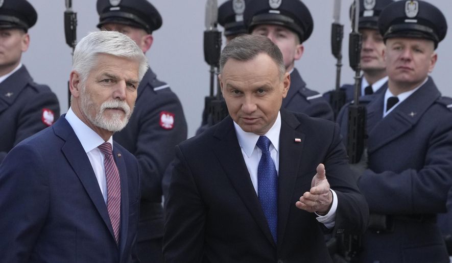 Poland&#x27;s President Andrzej Duda, right, welcomes Czech Republic&#x27;s President Petr Pavel as they meet at the Presidential Palace in Warsaw, Poland, Thursday, March 16, 2023. (AP Photo/Czarek Sokolowski)