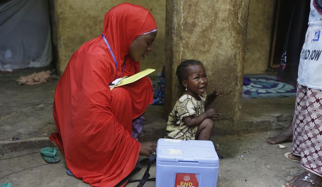 A child cries after she was administered with a polio vaccine during a house to house vaccination exercise in Maiduguri, Nigeria, on Aug. 28, 2016. Health officials in Burundi on Friday March 17, 2023 have declared an outbreak of polio linked to the vaccine, the first time the paralytic disease has been detected in the east African country for more than three decades. Across Africa, there were more than 400 cases of polio last year linked to the oral vaccine, including Congo, Nigeria, Ethiopia and Zambia. (AP Photo/Sunday Alamba, File)