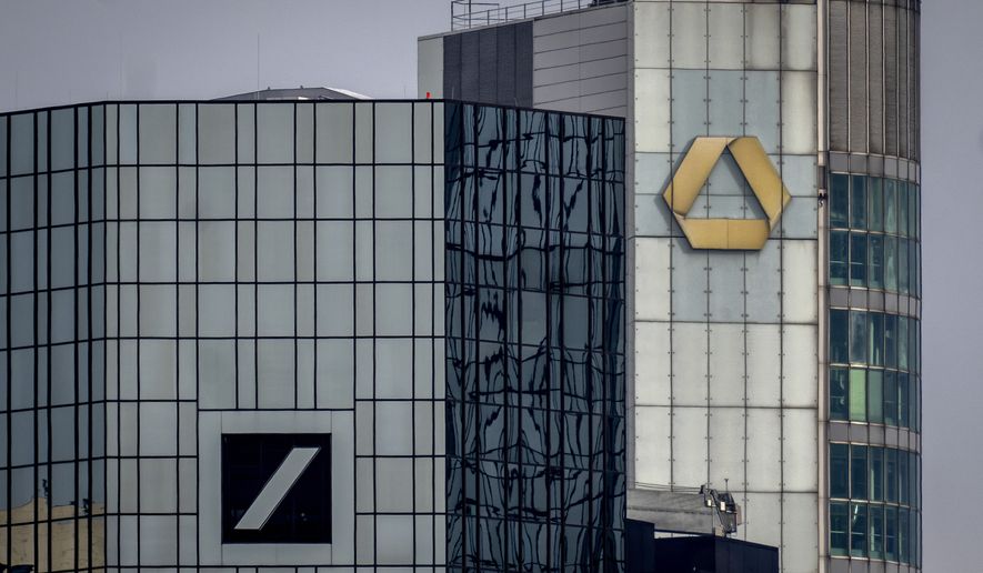 The headquarters of the German banks, Deutsche Bank, left, and Commerzbank are pictured in Frankfurt, Germany, Friday, March 17, 2023. (AP Photo/Michael Probst) ** FILE **