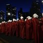 Israeli women&#x27;s rights activists dressed as characters in the popular television series, &quot;The Handmaid&#x27;s Tale,&quot; protest plans by Prime Minister Benjamin Netanyahu&#x27;s government to overhaul the judicial system, in Tel Aviv, Israel, Saturday, March 11, 2023. (AP Photo/Ohad Zwigenberg, File)