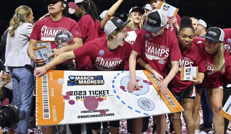 Washington State celebrates by &quot;punching their ticket&quot; after the team defeated UCLA in an NCAA college basketball game in the finals of the Pac-12 women&#x27;s tournament, Sunday, March 5, 2023, in Las Vegas. (AP Photo/David Becker)