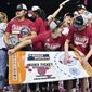 Washington State celebrates by &quot;punching their ticket&quot; after the team defeated UCLA in an NCAA college basketball game in the finals of the Pac-12 women&#x27;s tournament, Sunday, March 5, 2023, in Las Vegas. (AP Photo/David Becker)