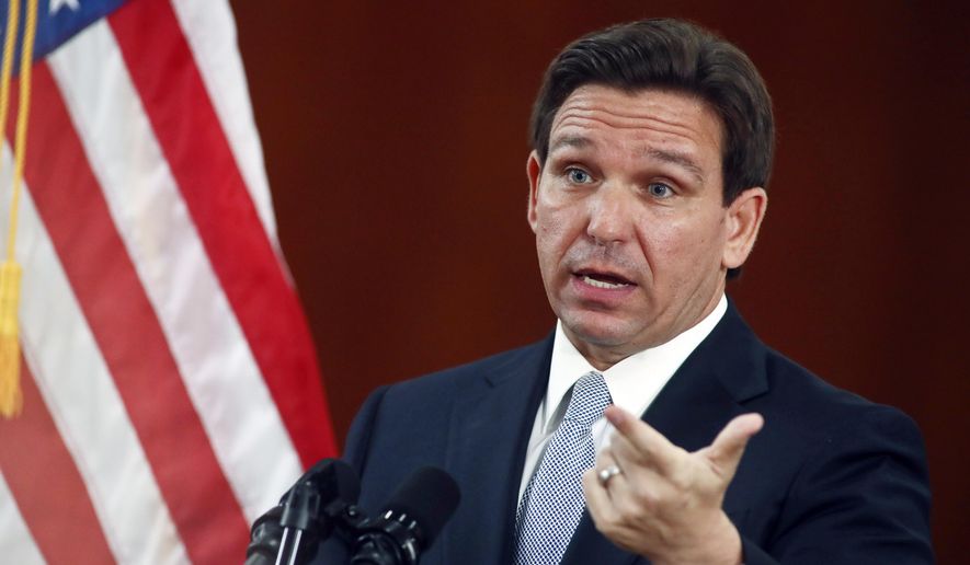 Florida Gov. Ron DeSantis answers questions from the media in the Florida Cabinet following his State of the State address during a joint session of the Senate and House of Representatives, Tuesday, March 7, 2023, at the state Capitol in Tallahassee, Fla. Texas and Florida are being led by tough-talking Republican governors weighing presidential runs as their state lawmakers debate especially strict legislation on border security. (AP Photo/Phil Sears, File)