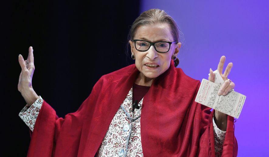 Supreme Court Justice Ruth Bader Ginsburg gestures to students before she speaks at Amherst College in Amherst, Mass, on Oct. 3, 2019. The late Justice Ginsburg is being remembered during ceremonies at the Supreme Court on Friday, March 17, 2023. (AP Photo/Jessica Hill, File)