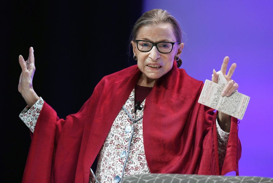 Supreme Court Justice Ruth Bader Ginsburg gestures to students before she speaks at Amherst College in Amherst, Mass, on Oct. 3, 2019. The late Justice Ginsburg is being remembered during ceremonies at the Supreme Court on Friday, March 17, 2023. (AP Photo/Jessica Hill, File)