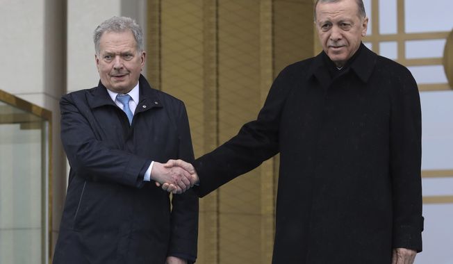 Turkish President Recep Tayyip Erdogan, right, and Finland&#x27;s President Sauli Niinisto shake hands during a welcome ceremony at the presidential palace in Ankara, Turkey, Friday, March 17, 2023. Erdogan greeted his Finnish counterpart in Ankara on Friday amid hopes that their meeting will see Turkey approve Finland&#x27;s NATO membership bid. (AP Photo/Burhan Ozbilici)