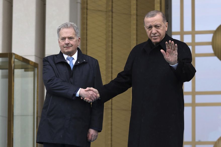 Turkish President Recep Tayyip Erdogan, right, and Finland&#x27;s President Sauli Niinisto shake hands during a welcome ceremony at the presidential palace in Ankara, Turkey, Friday, March 17, 2023. Erdogan greeted his Finnish counterpart in Ankara on Friday amid hopes that their meeting will see Turkey approve Finland&#x27;s NATO membership bid. (AP Photo/Burhan Ozbilici)