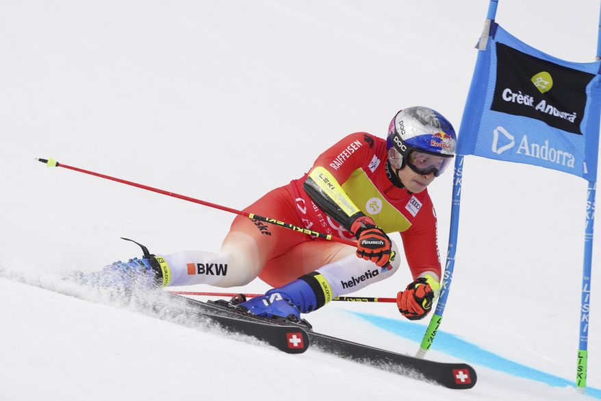 Switzerland&#x27;s Marco Odermatt speeds down the course during a men&#x27;s World Cup giant slalom race, in Soldeu, Andorra, Saturday, March 18, 2023. (AP Photo/Giovanni Zenoni)