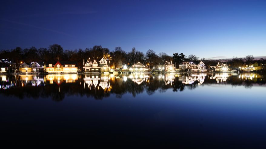 Lights illuminate the outline of structures on Boathouse Row along the banks of the Schuylkill River in Philadelphia, Thursday, March 16, 2023. (AP Photo/Matt Rourke)