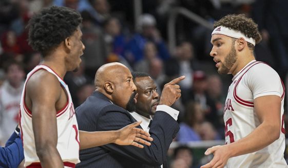 Indiana head coach Mike Woodson, second from left, instructs his players against Kent State during the first half of a first-round college basketball game in the NCAA Tournament, Friday, March 17, 2023, in Albany, N.Y. (AP Photo/Hans Pennink)