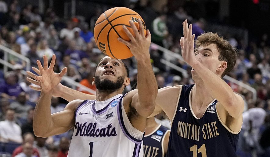 Kansas State guard Markquis Nowell drives to the basket past Montana State guard Tyler Patterson during the first half of a first-round college basketball game in the NCAA Tournament on Friday, March 17, 2023, in Greensboro, N.C. (AP Photo/Chris Carlson)