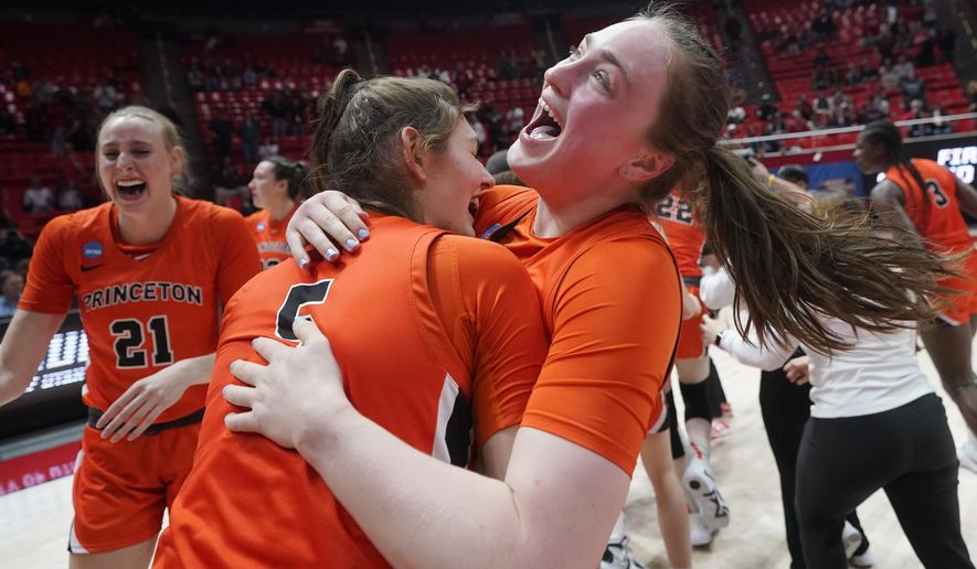 Princeton forward Katie Thiers, right, celebrates Paige Morton following the team&#x27;s victory over North Carolina State in a first-round college basketball game in the women&#x27;s NCAA Tournament, Friday, March 17, 2023, in Salt Lake City. (AP Photo/Rick Bowmer)