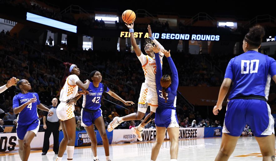 Tennessee forward Rickea Jackson (2) shoots as she collides with Saint Louis forward Peyton Kennedy (32) in the first half of a first-round college basketball game in the NCAA Tournament, Saturday, March 18, 2023, in Knoxville, Tenn. (AP Photo/Wade Payne)