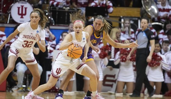 Indiana&#x27;s Grace Berger, left, makes a steal against Tennessee Tech&#x27;s Anna Walker during the first half of a first-round college basketball game in the women&#x27;s NCAA Tournament Saturday, March 18, 2023, in Bloomington, Ind. (AP Photo/Darron Cummings)