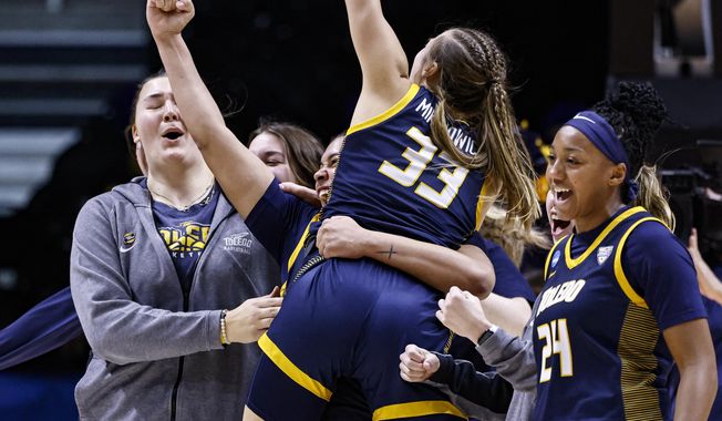 Toledo guard Yaniah Curry (24), guard Sammi Mikonowicz (33), and guard Justina King (1) celebrate after a first-round college basketball game against Iowa State in the NCAA Tournament, Saturday, March 18, 2023, in Knoxville, Tenn. (AP Photo/Wade Payne)