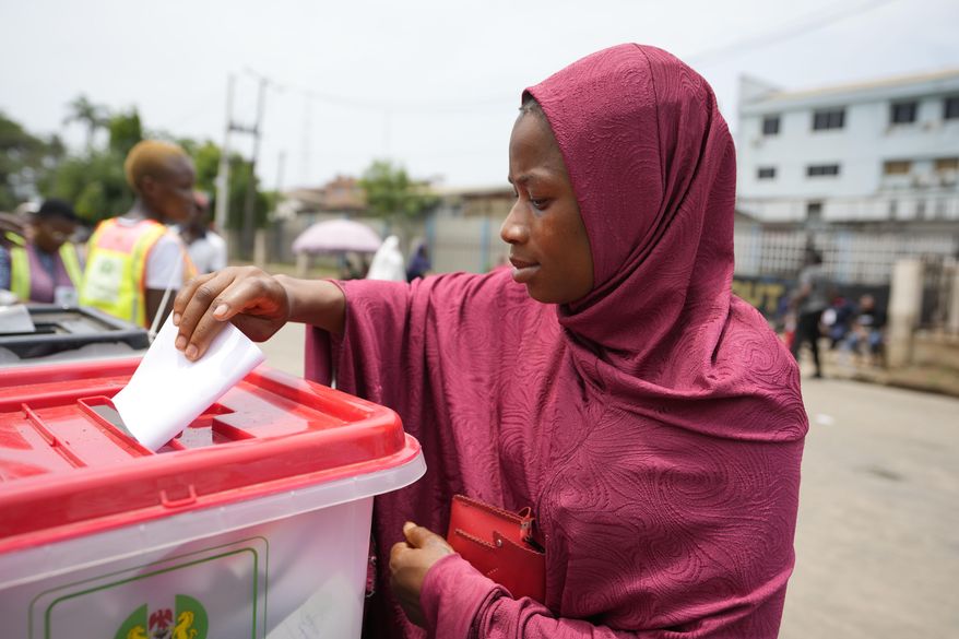 A woman cast her ballot during the gubernatorial and state Assembly elections in Lagos , Nigeria, Saturday, March 18, 2023. Millions of Nigerians are headed back to the polls Saturday as Africa&#x27;s most populous nation holds gubernatorial elections amid tensions after last month&#x27;s disputed presidential vote. New governors are being chosen for 28 of Nigeria&#x27;s 36 states as the opposition continues to reject the victory of President-elect Bola Tinubu from the West African nation&#x27;s ruling party (AP Photo/Sunday Alamba)