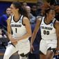 Colorado&#x27;s Tayanna Jones (1) celebrates a basket with teammate Jaylyn Sherrod (00) during the first half of a first-round college basketball game against Middle Tennessee State in the NCAA Tournament, Saturday, March 18, 2023, in Durham, N.C. (AP Photo/Karl B. DeBlaker)