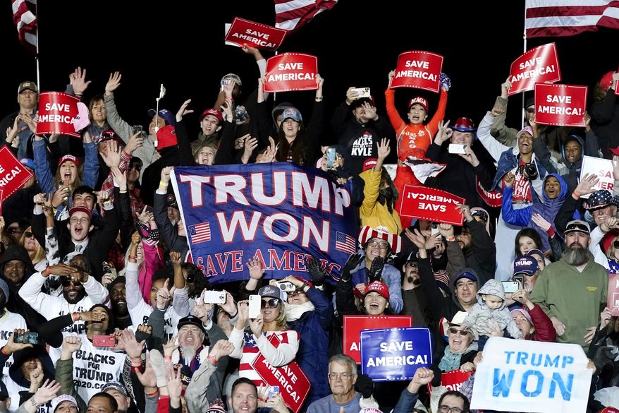 Supporters of former President Donald Trump cheer as he speaks at a Save America Rally. Jan. 15, 2022, in Florence, Ariz. (AP Photo/Ross D. Franklin, File)