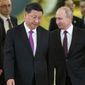 Chinese President Xi Jinping, left, and Russian President Vladimir Putin enter a hall for talks in the Kremlin in Moscow, Russia, June 5, 2019. The Chinese government said Xi would visit Moscow from March 20 to March 22, 2023, but gave no indication when he departed. The Russian government said Xi was due to arrive at midday and meet later with Putin. (AP Photo/Alexander Zemlianichenko, Pool, File)